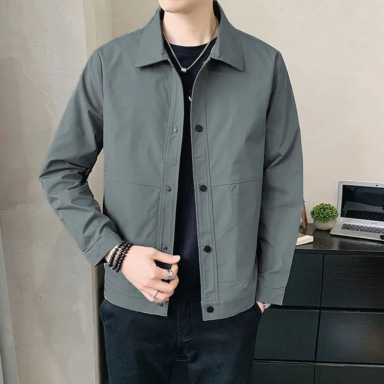 Man wearing a thin, grey, Korean-style long sleeve casual jacket for spring or autumn.