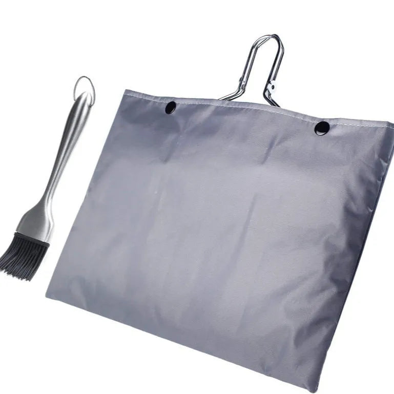 Square folding stainless steel wire barbecue mesh basket with a cleaning brush on a grill.