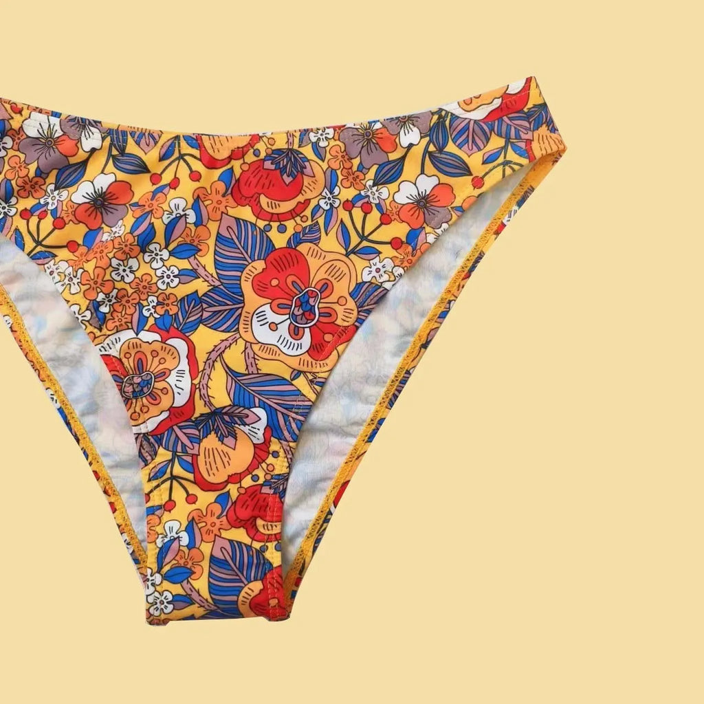 Plus size women's floral print bikini set with strapped design and brief style