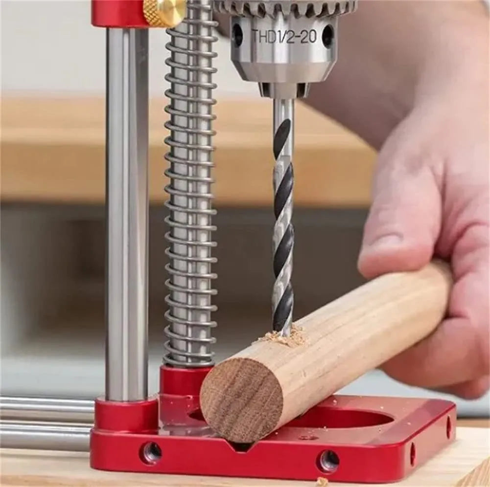 Woodworking drill locator with metal body and red or black plastic guide for drilling wood