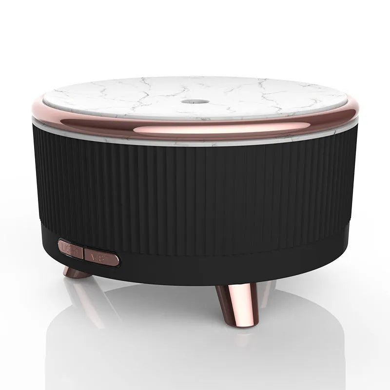 Cylinder plastic USB humidifier in black with 500ml tank and single fog outlet on a bedside table