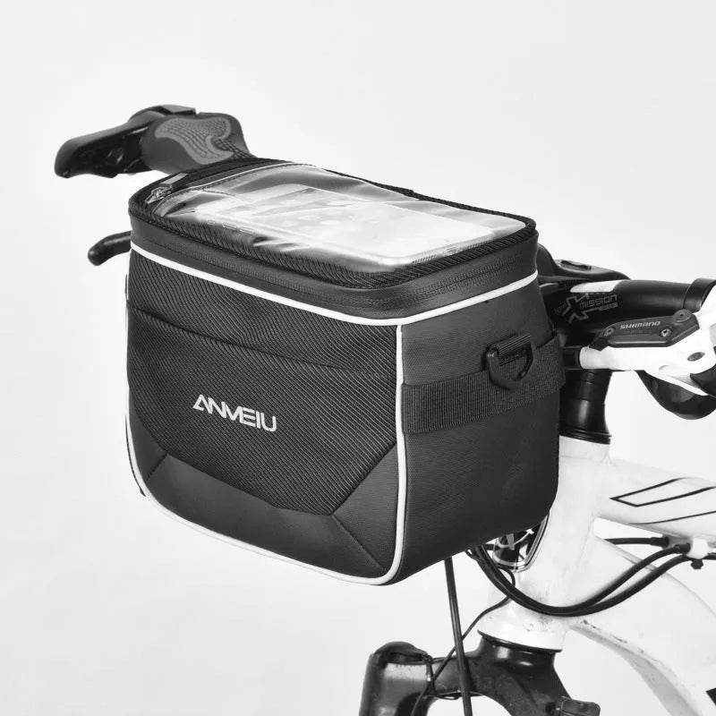 Black polyester bicycle handlebar bag with quick-release straps mounted on bicycle
