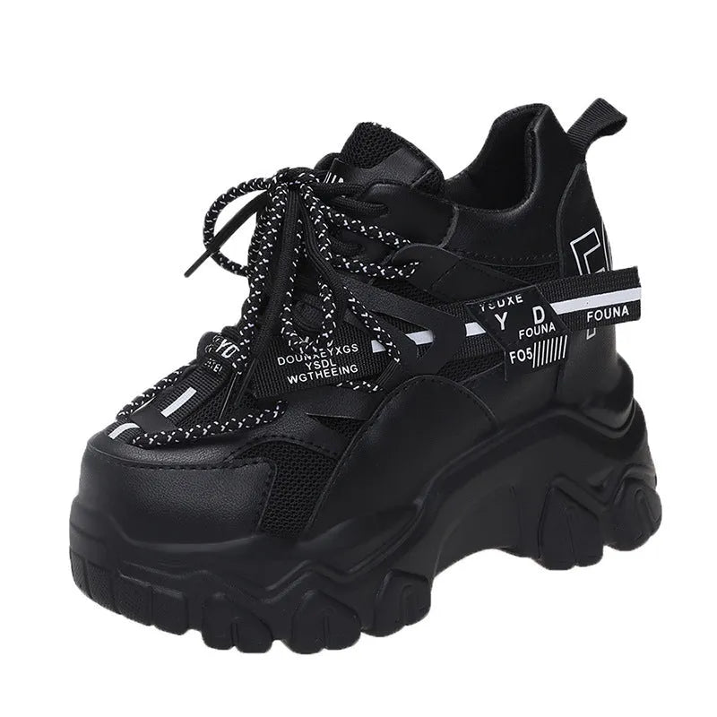 White women's platform sports shoes with mesh upper, cross strap, and a thick rubber sole.