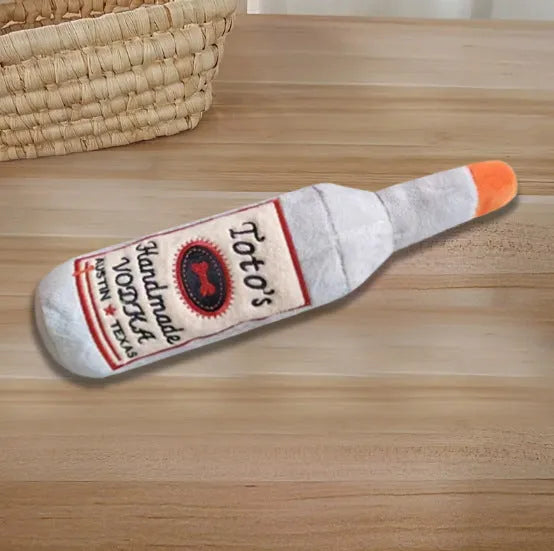 Brown plush wine bottle shaped dog chew toy for dental cleaning and interactive play
