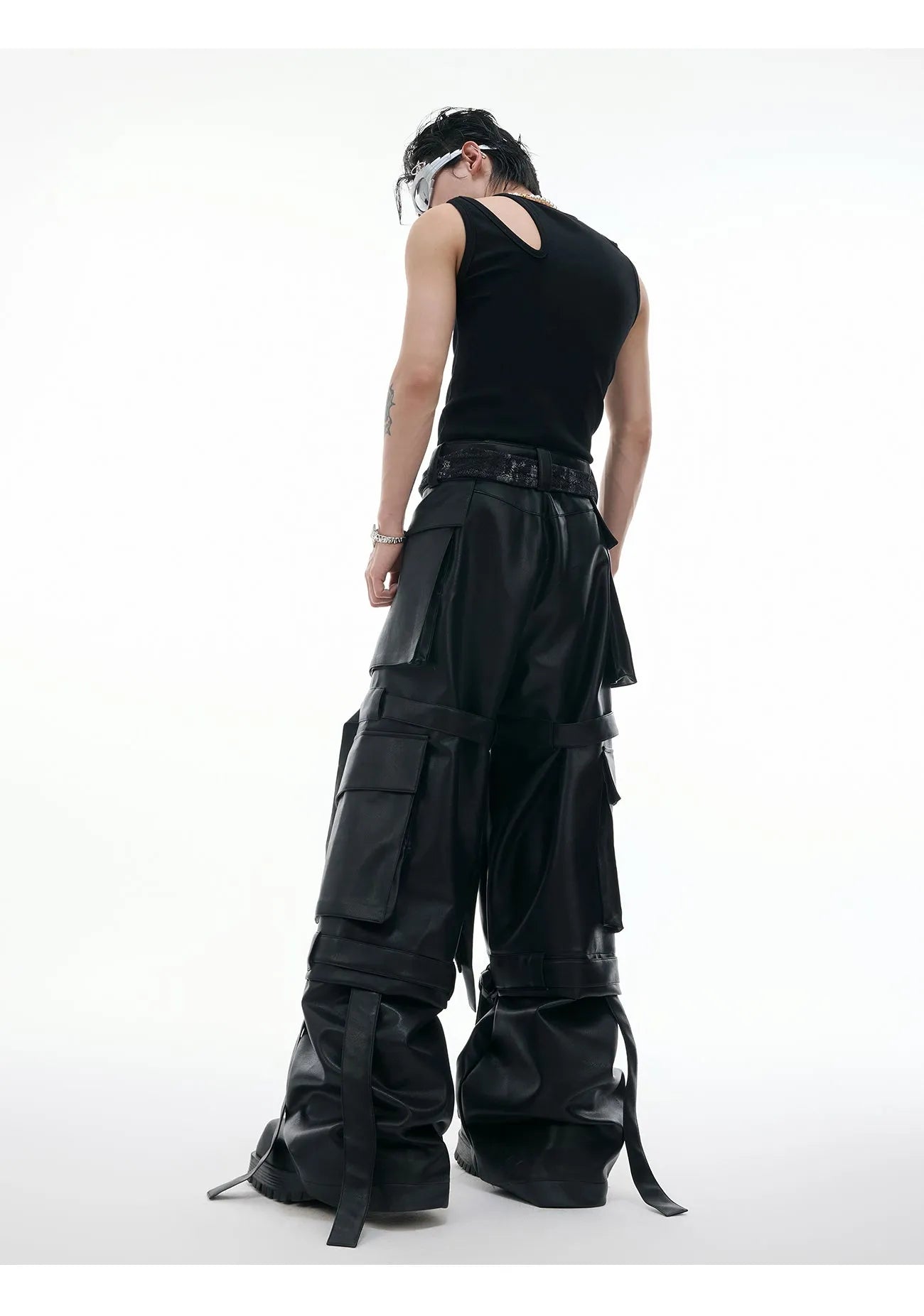 Black loose-fit trousers with quilted stitching pattern and multiple pockets