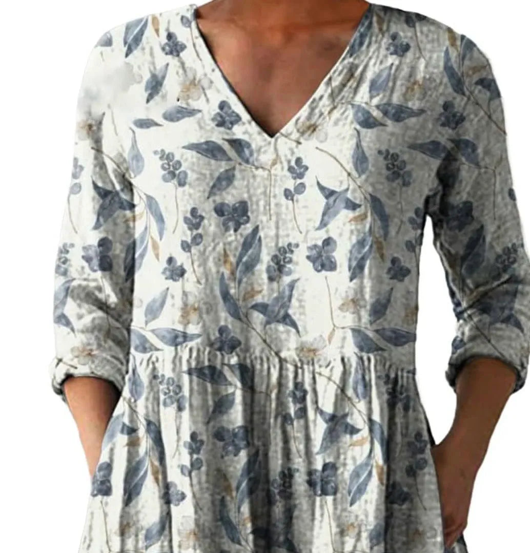 Women's loose-fitting long dress with a blue wave pattern print and 3/4 sleeves.