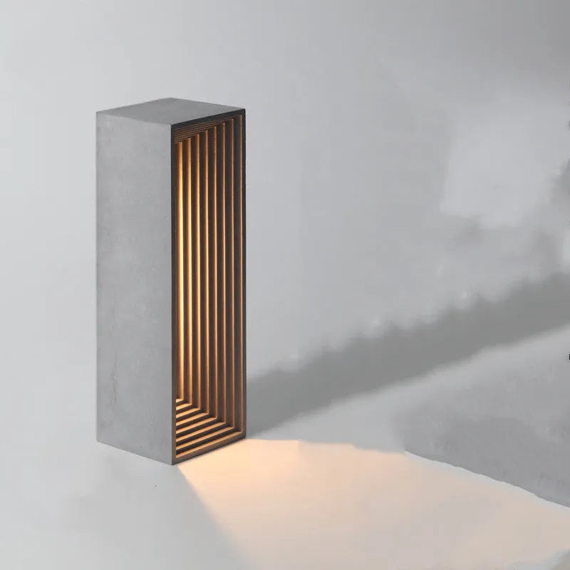 Concrete building night light table lamp in cement grey with LED illumination and Nordic style