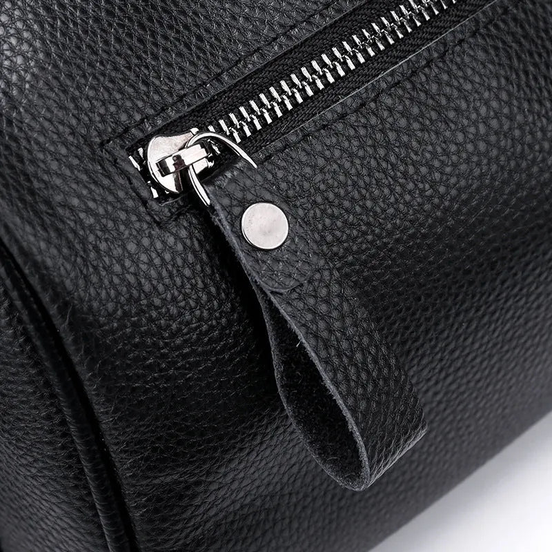 Black genuine leather one-shoulder crossbody bag with dimensions 24x16x13cm