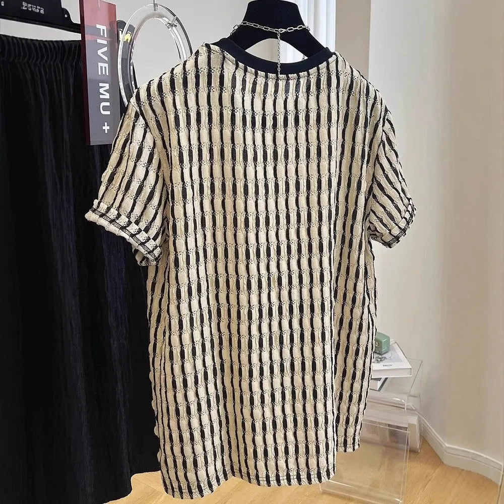Black and white striped men's loose fit short sleeve pullover shirt made from linen silk blend fabric.