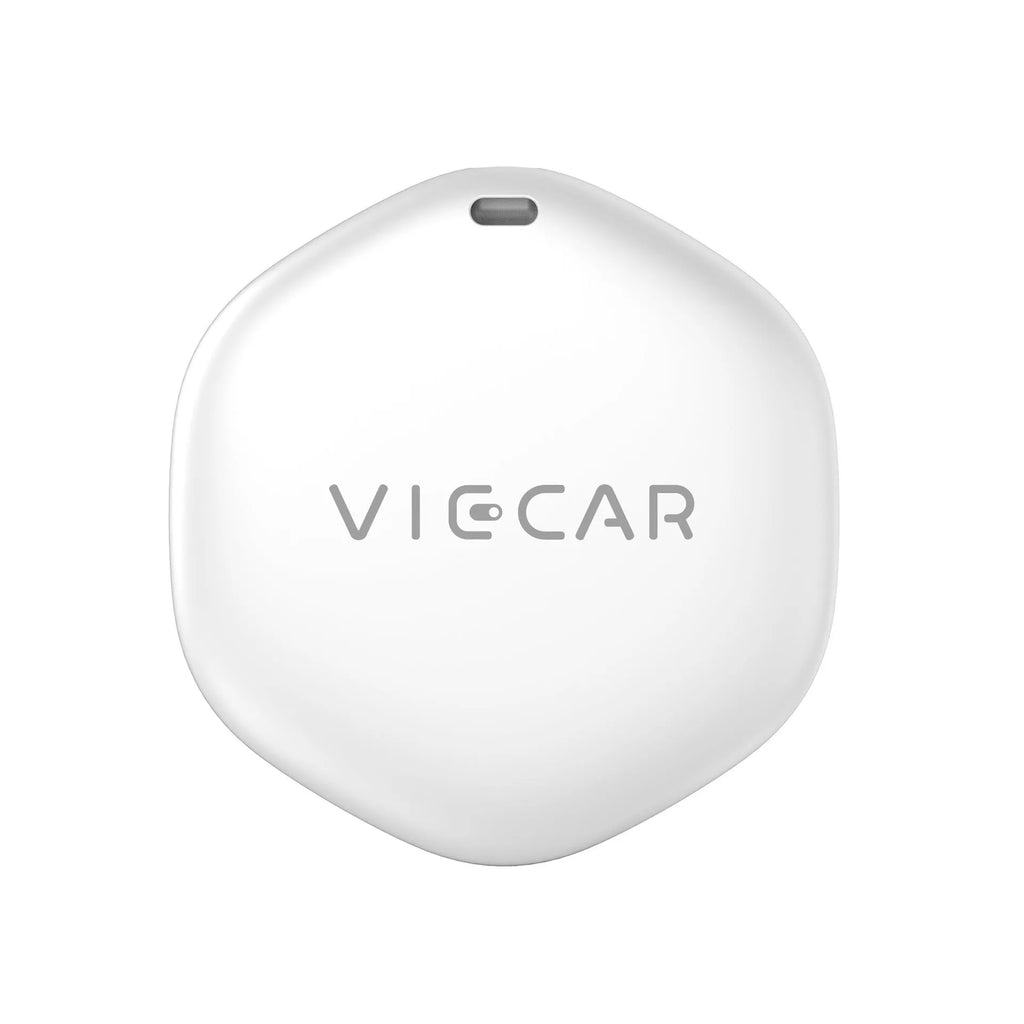 White ITag smart anti-lost tracker on a table with a keyring, showing Bluetooth 5.1 compatibility for Apple devices