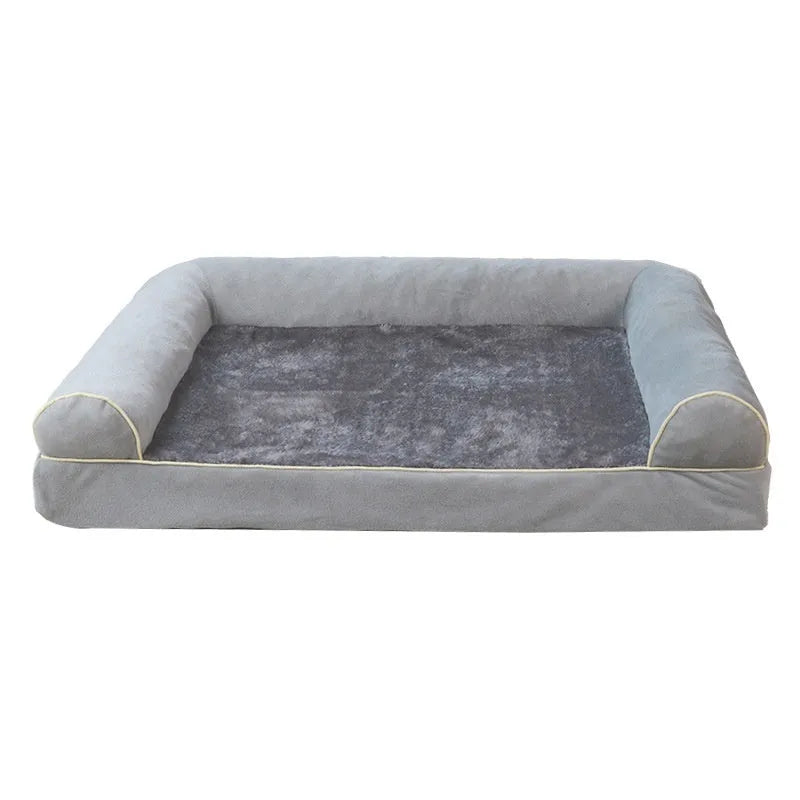Square sponge dog bed in blue cloth, showing its raised breathable design on a wooden floor.