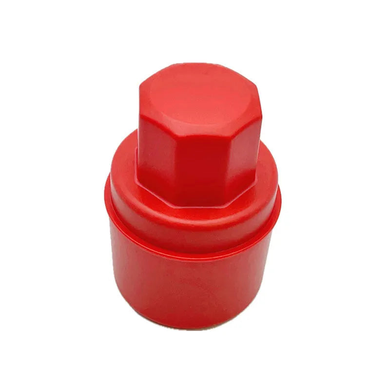 Black and red car tyre polishing sponge brushes with lids on a workbench.