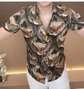 Men's casual shirt with a large-scale contemporary print, button-down collar, and long sleeves.