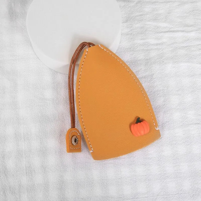 Cartoon pull-out key case in PU leather measuring 14 x 7.5 cm with colourful designs