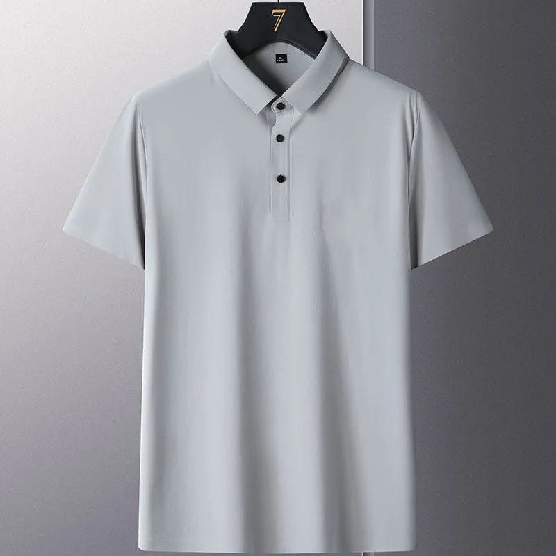 Man wearing a solid colour non-ironing business casual short sleeve shirt in a light blue shade.