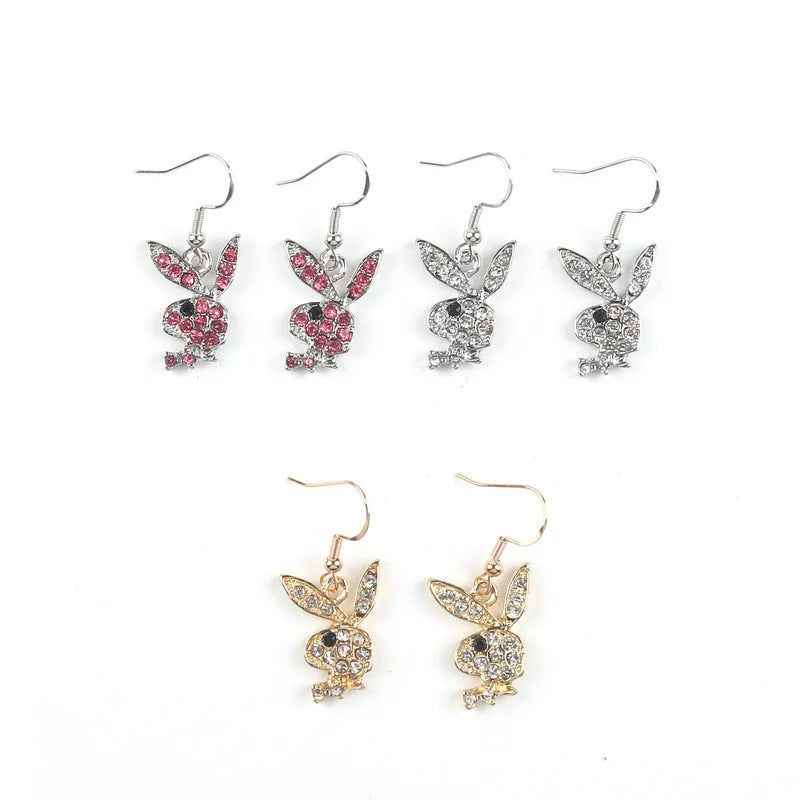 Close-up of rabbit-shaped alloy stud earrings in gold, pink, and silver colour options.