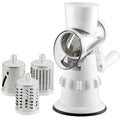 White manual vegetable slicer, grater, and chopper with three stainless steel blades and suction feet.