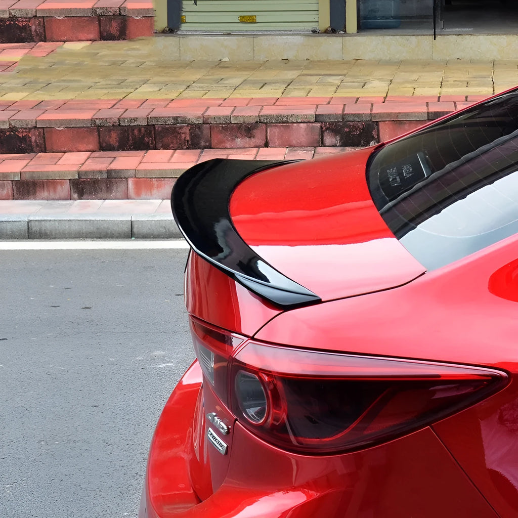 Bright black Mazda 3 tail trim for 2014-2021 models with large fixed wind surround design
