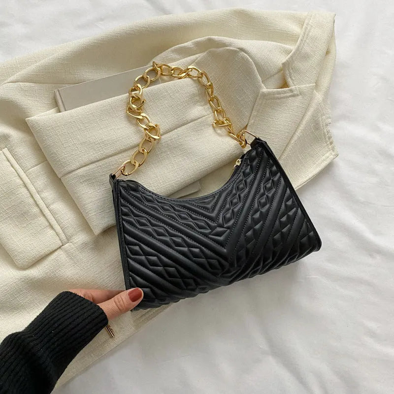 Brown pleated chain baguette shoulder bag showing vertical square shape and soft carry handle