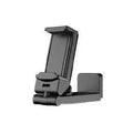 Black foldable rotating universal phone holder shown open on a desk, holding a smartphone.