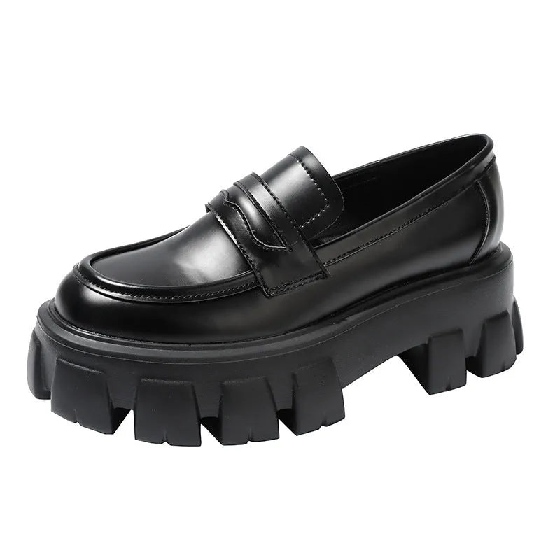 British style wide-fit loafers in patent leather with a muffin base heel and rubber sole.