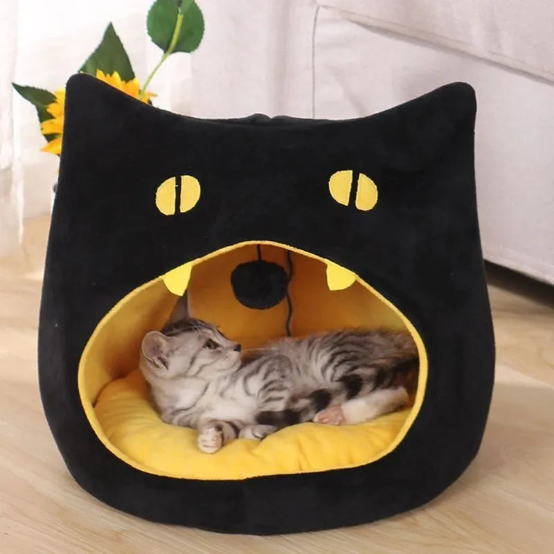 Enclosed cat-shaped pet bed with plush fabric and covered cave design