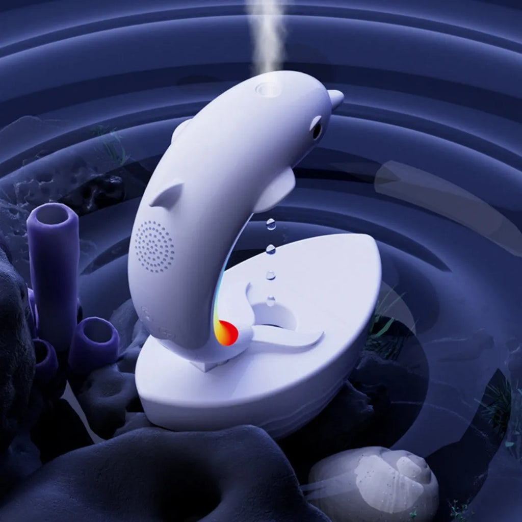 Dolphin-shaped Bluetooth speaker humidifier in white with fine mist output and sea light glow