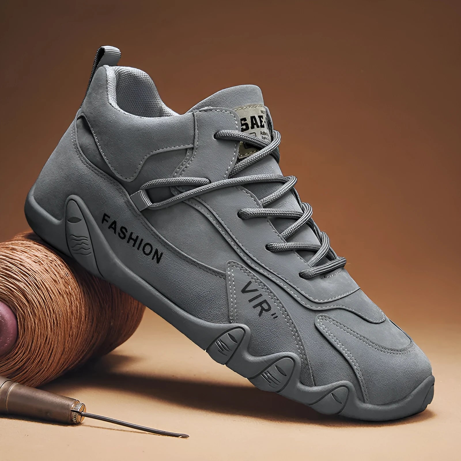 Men's grey low-top casual shoes with synthetic leather upper, round toe, and elastic band closure.