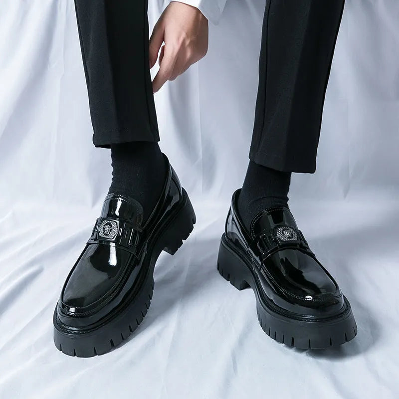 Men's glossy black platform loafers with hidden low heel, showing PU leather construction