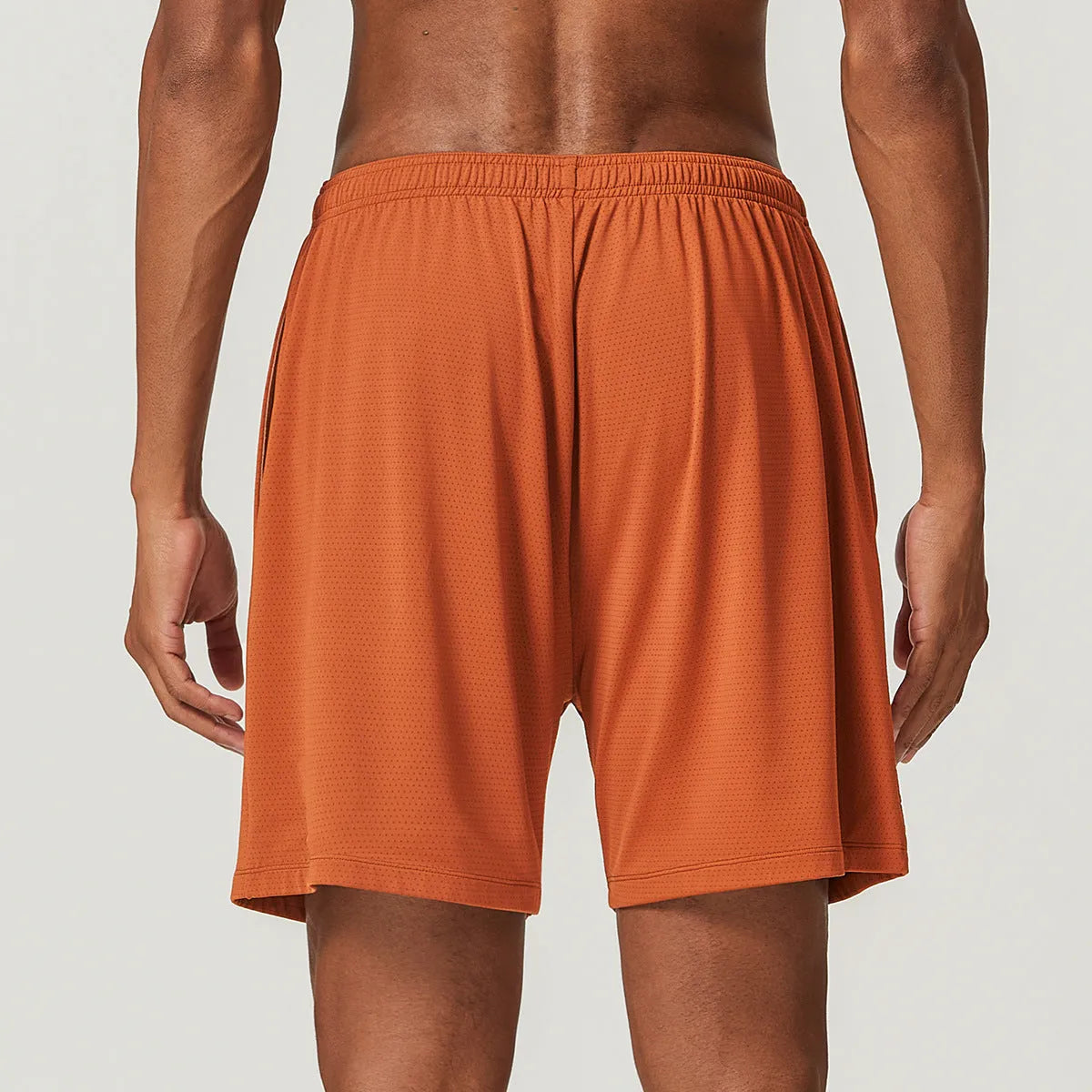 Men's quick-dry running shorts in sky green, showing double-layer construction and mid-waist short length.