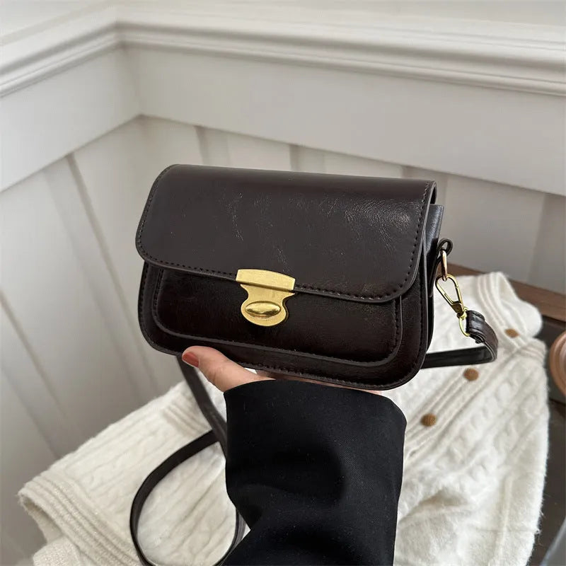 Soft PU leather retro small square handbag in black, brown, dark brown, or light brown.