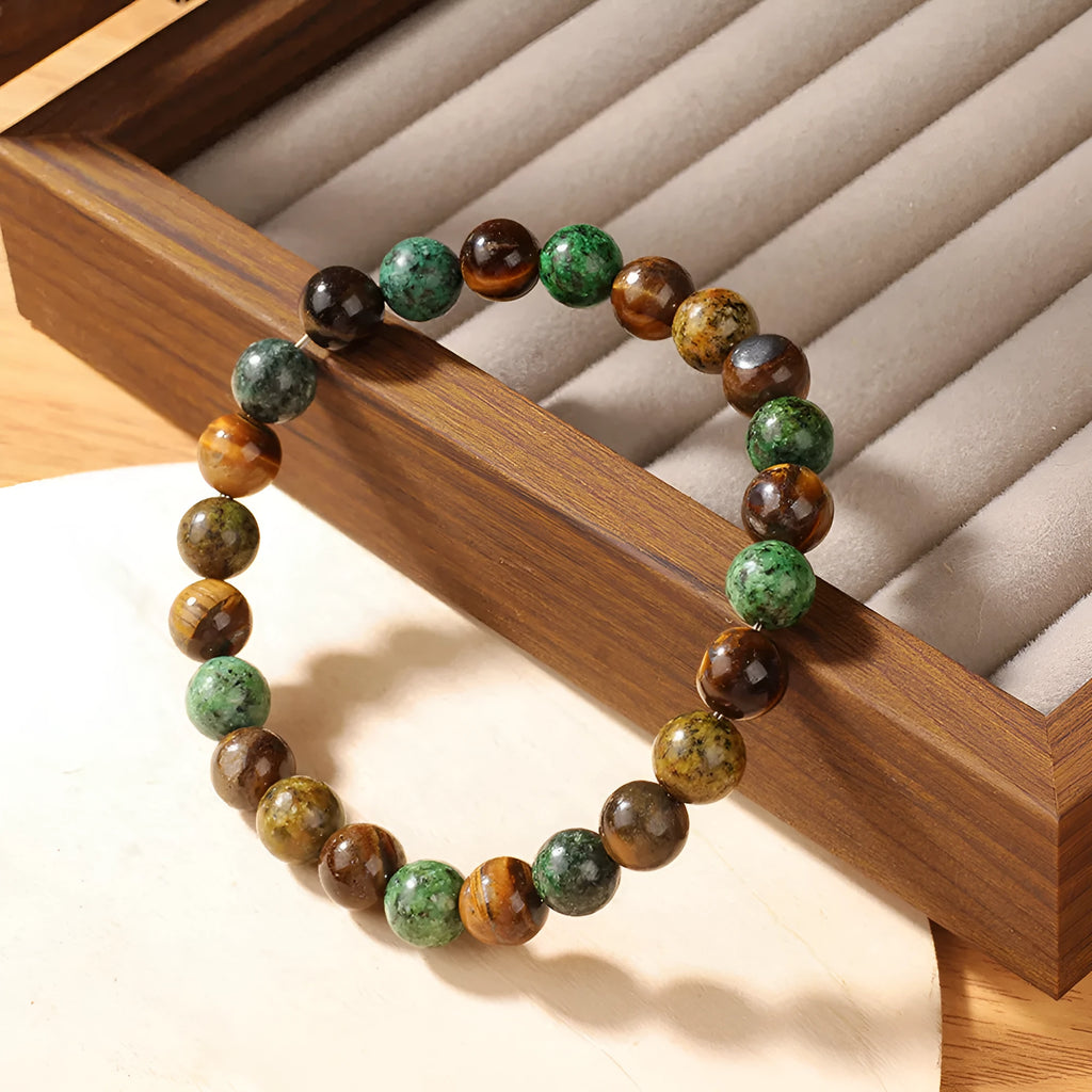 Handmade tigereye stone bracelet with 18mm flower-design beads on an adjustable strap.
