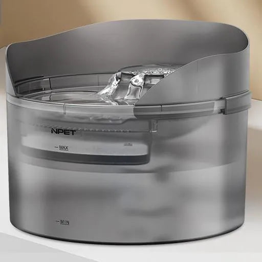Automatic circulating water dispenser for cats and dogs with filter and pump on a kitchen floor.