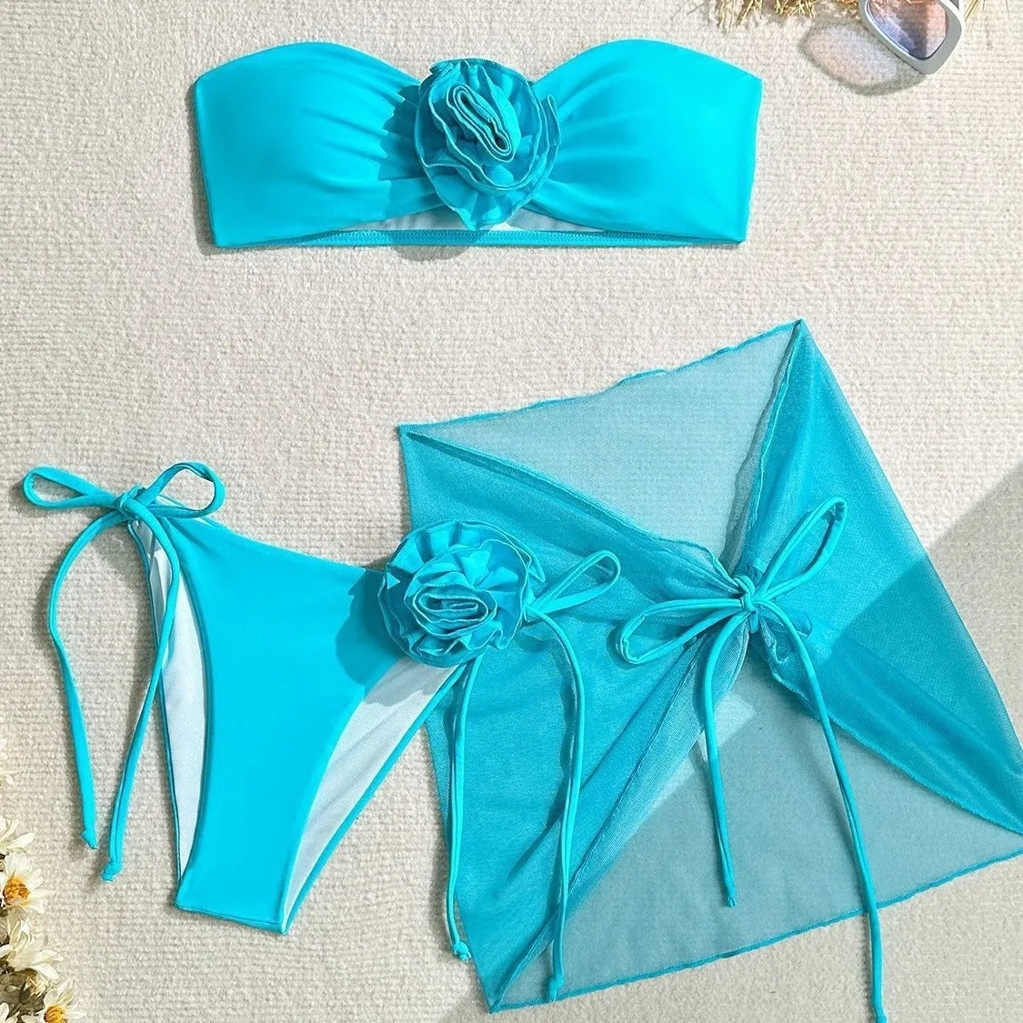 Women's pink tube top swimsuit with large 3D flower tie and matching skirt.