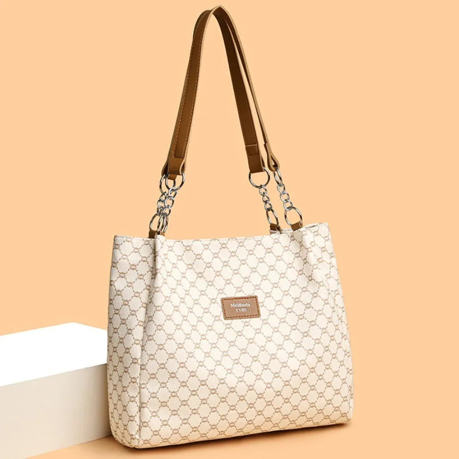 Women's retro fashion handbag in soft brown PU leather with polyester lining.