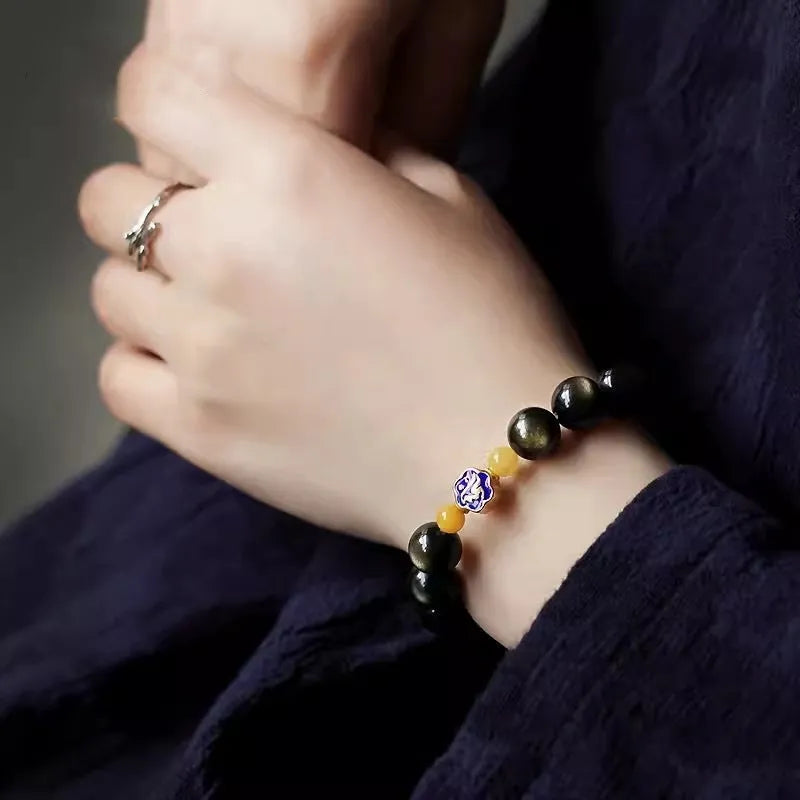 Golden obsidian bracelet with 10mm zodiac animal beads in geometric ethnic design