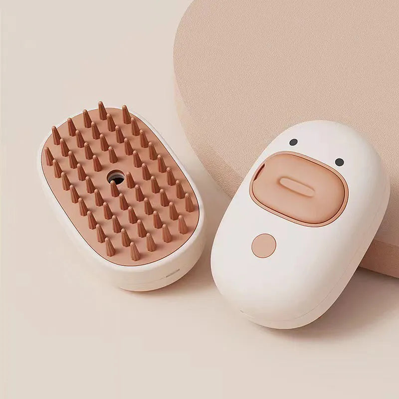 White pet steam brush with silicone comb teeth and water tank for dog and cat grooming