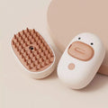 White pet steam brush with silicone comb teeth and water tank for dog and cat grooming