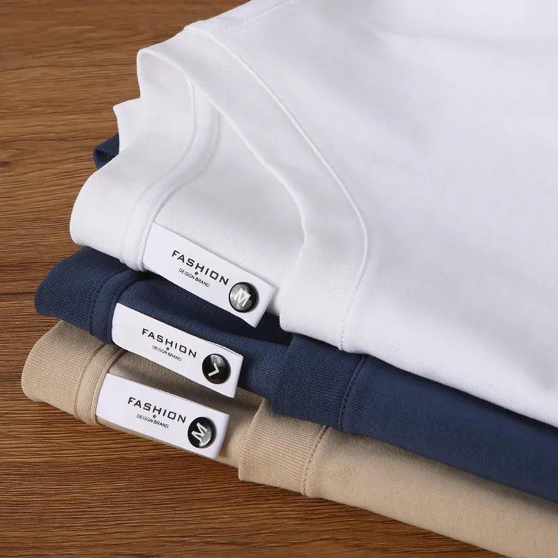 Heavy 230g cotton blend drop shoulder t-shirt in a solid colour, showing loose fit and short sleeves.