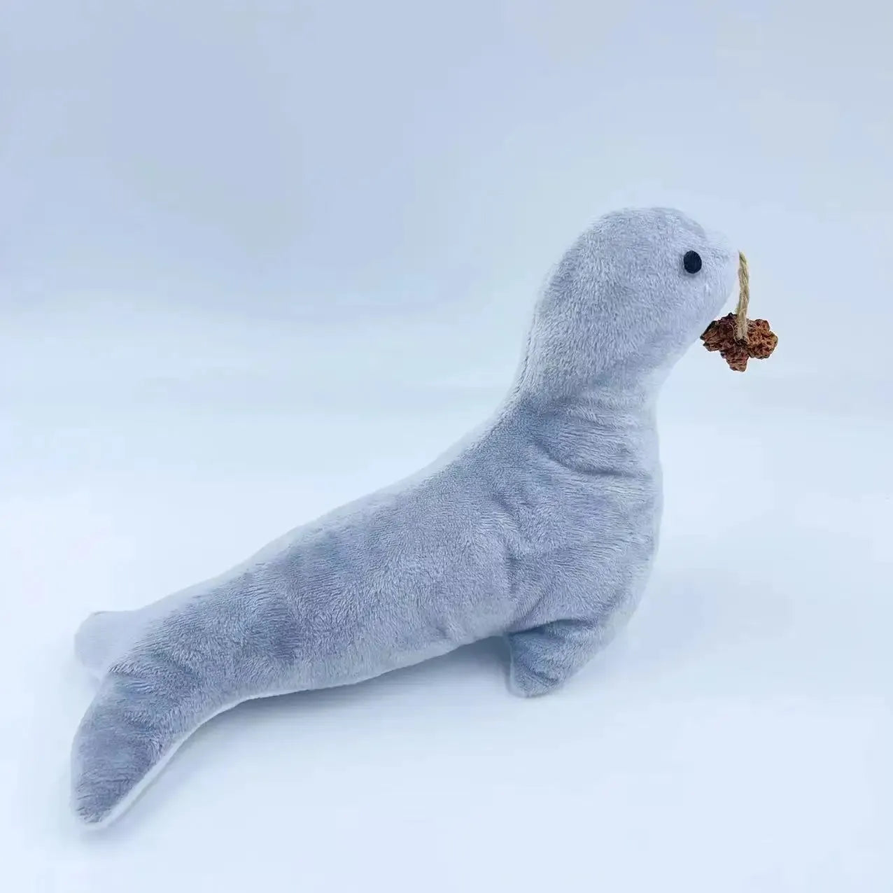 Blue sea lion plush cat toy with bell sound catnip scent and gall fruit texture for teeth grinding