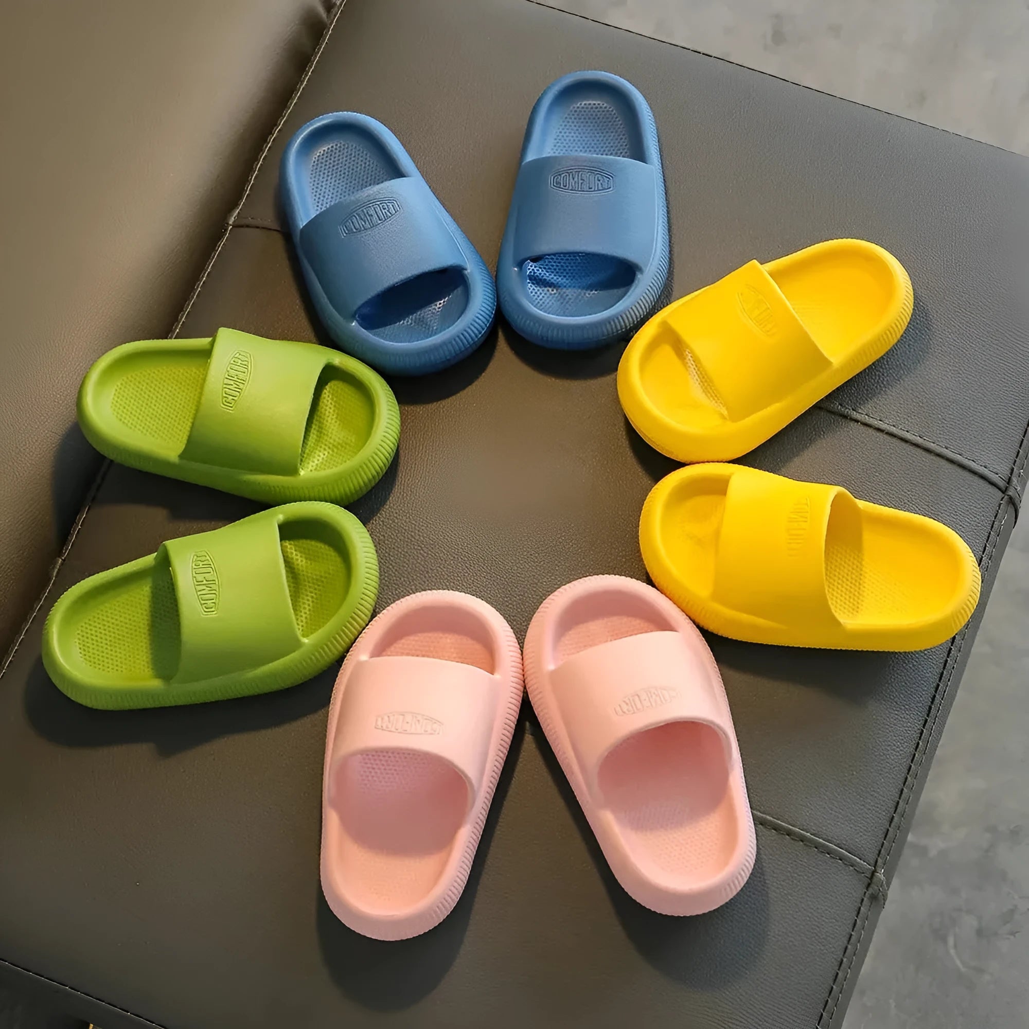 Children's mixed colour EVA slippers with a non-slip sole, shown in sizes for kids.