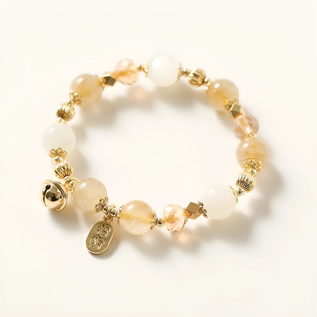 Korean style gold bracelet with rutilated quartz crystal charms on an electroplated chain.