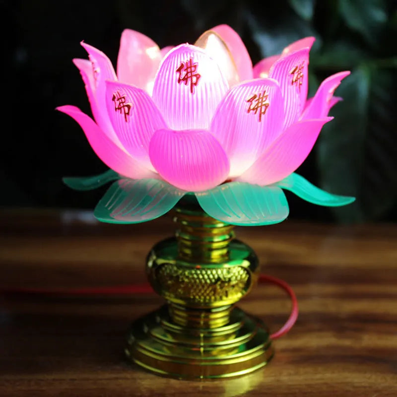 Plug-in Buddha worship lamp with colourful LED lotus flower design on a home altar.