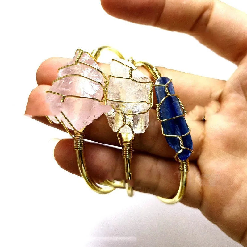 Natural crystal rough stone bracelet with gold winding geometric design showing colour mixing finish