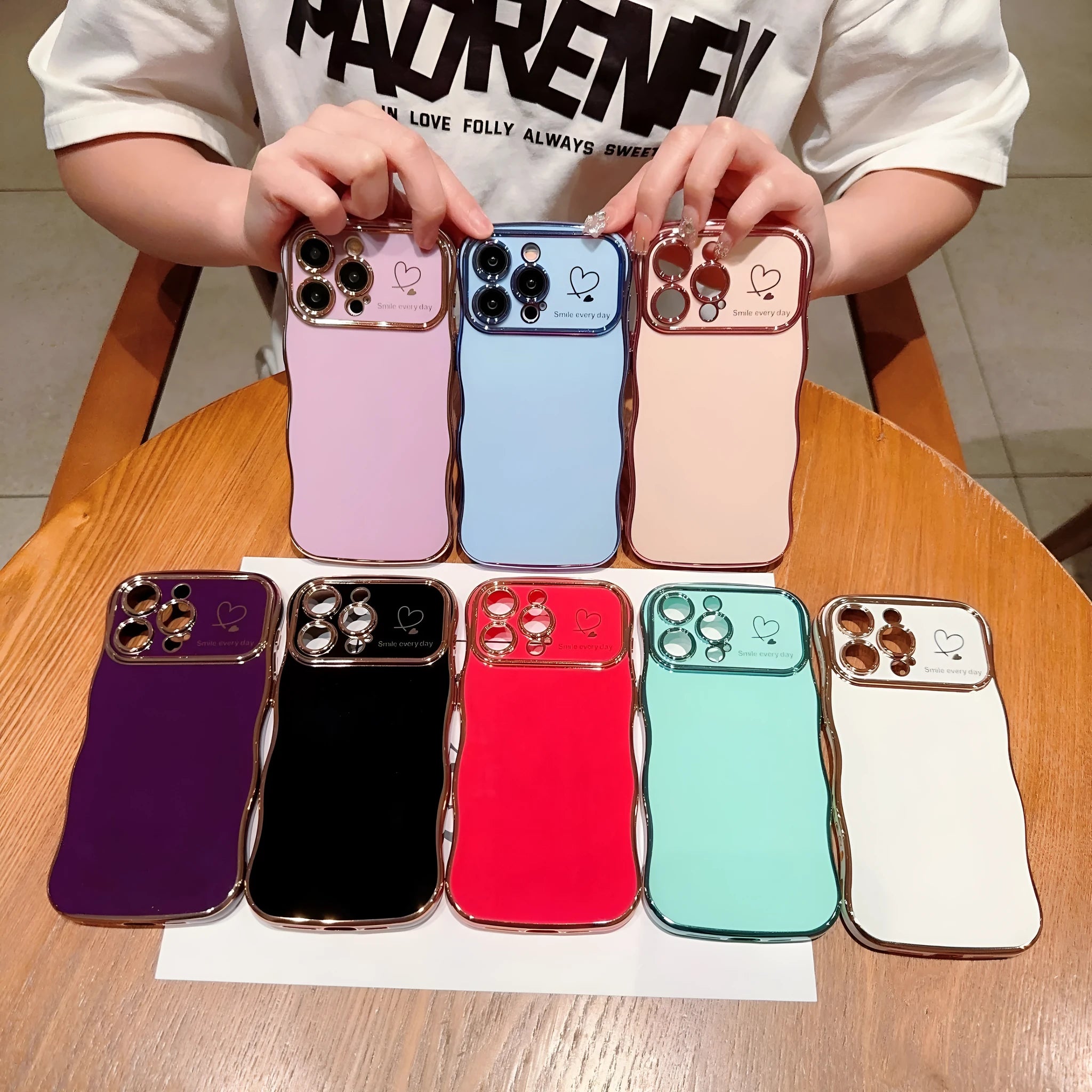 Electroplating wave love large window phone case in black, side view showing back cover and cutouts for iPhone