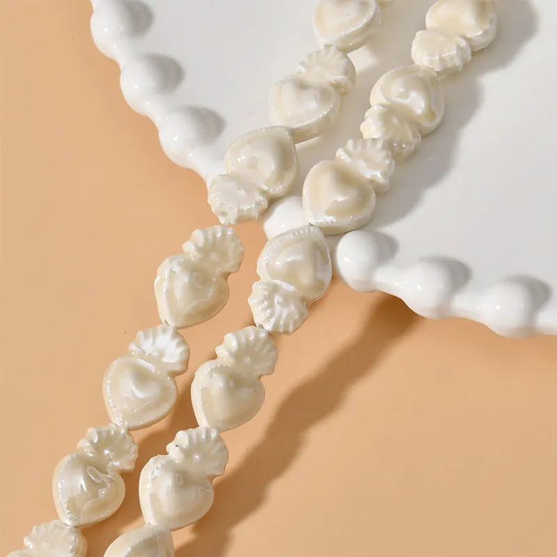 Ceramic love heart small torch shaped beads in various colours with straight holes for jewellery making