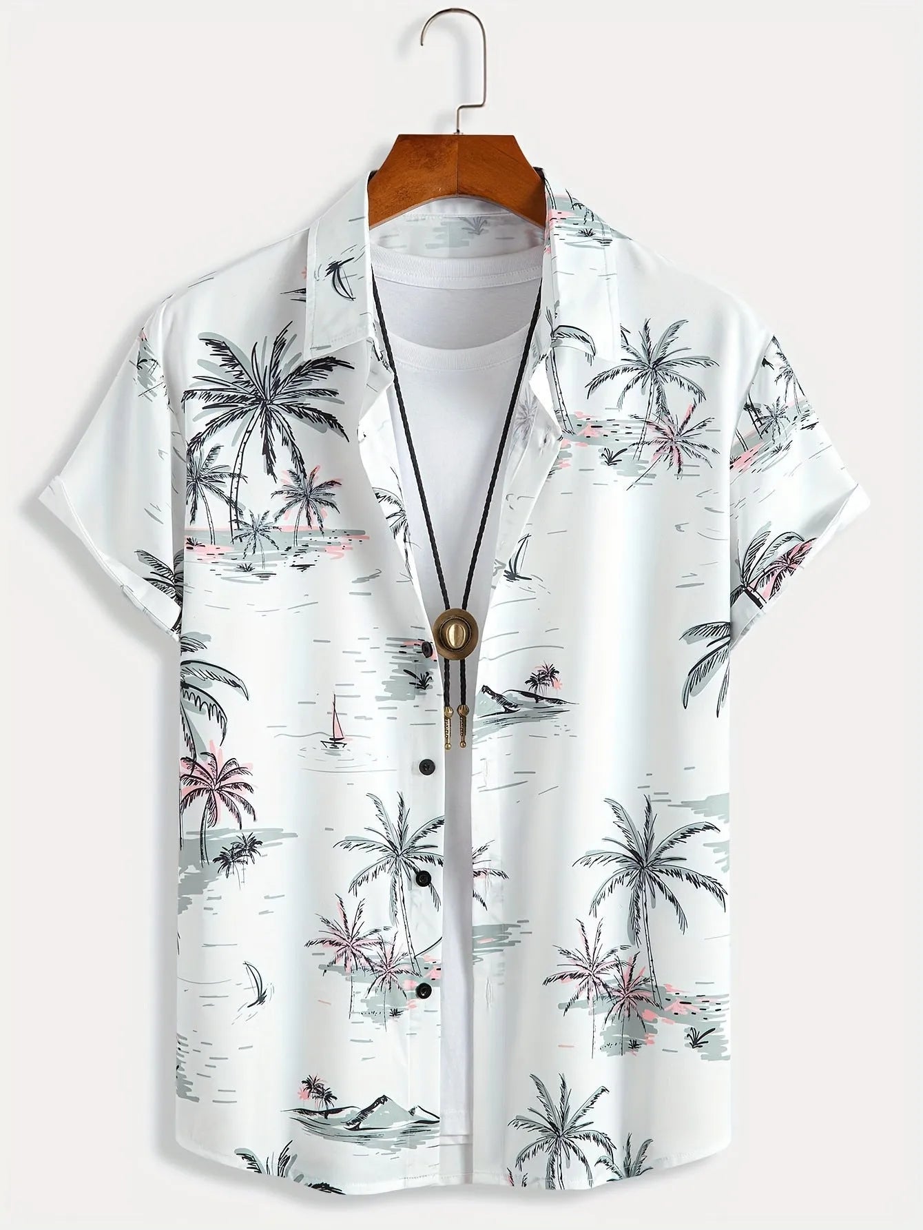 Man wearing a loose-fit floral print short sleeve shirt in a cardigan style.
