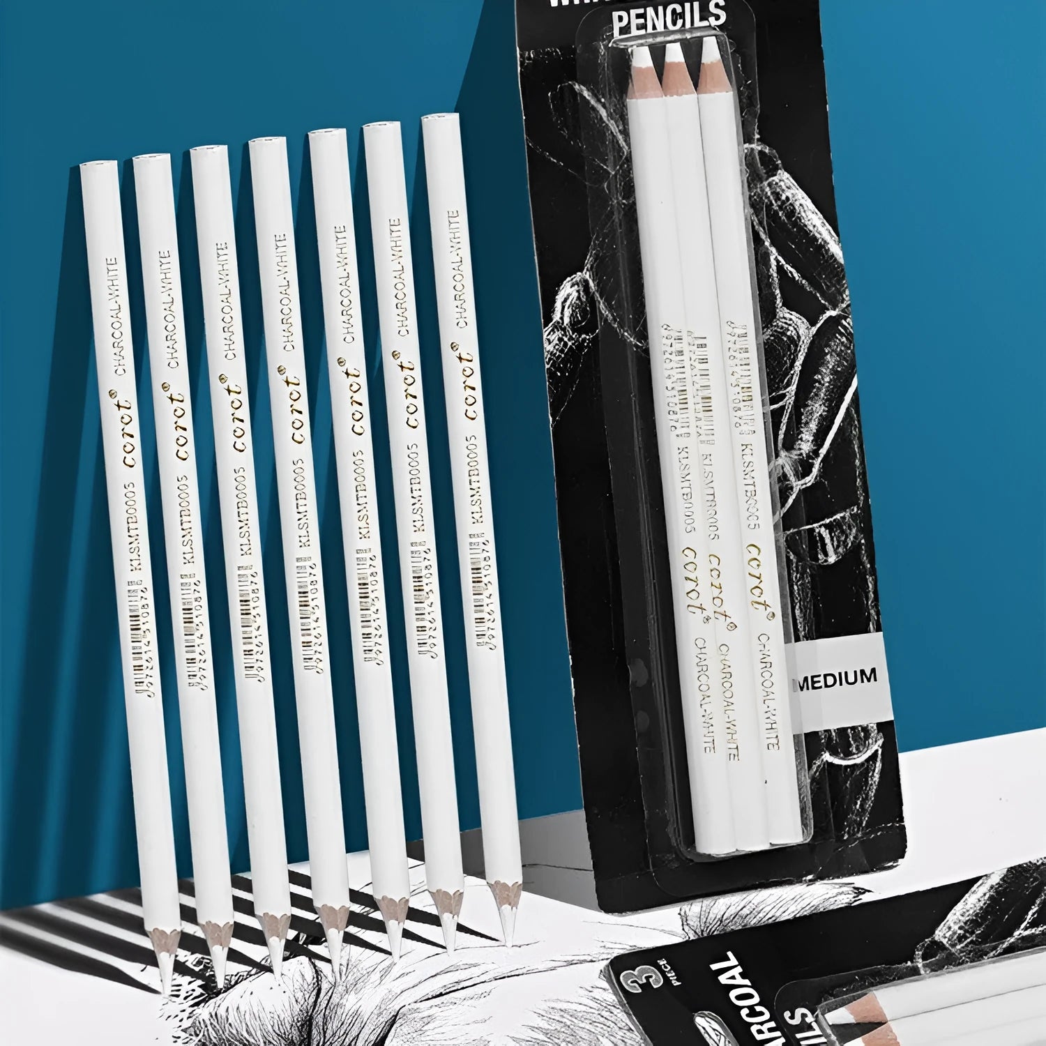 Set of three white charcoal pencils with wooden barrels for drawing on dark paper.