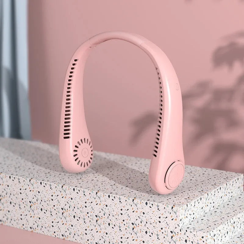 White USB rechargeable bladeless neck fan being worn, showing adjustable speed buttons.