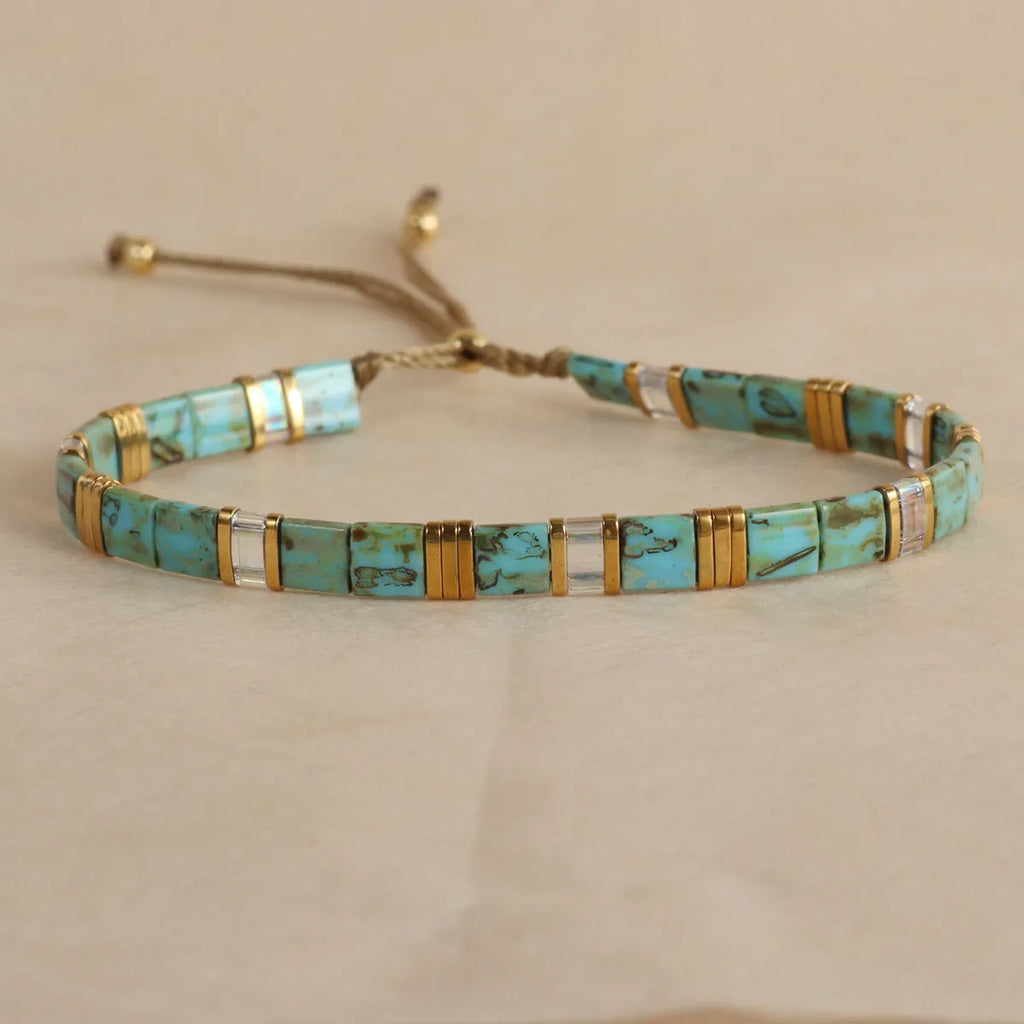 Geometric glass beaded bracelet in five colour options with pull beads adjustment
